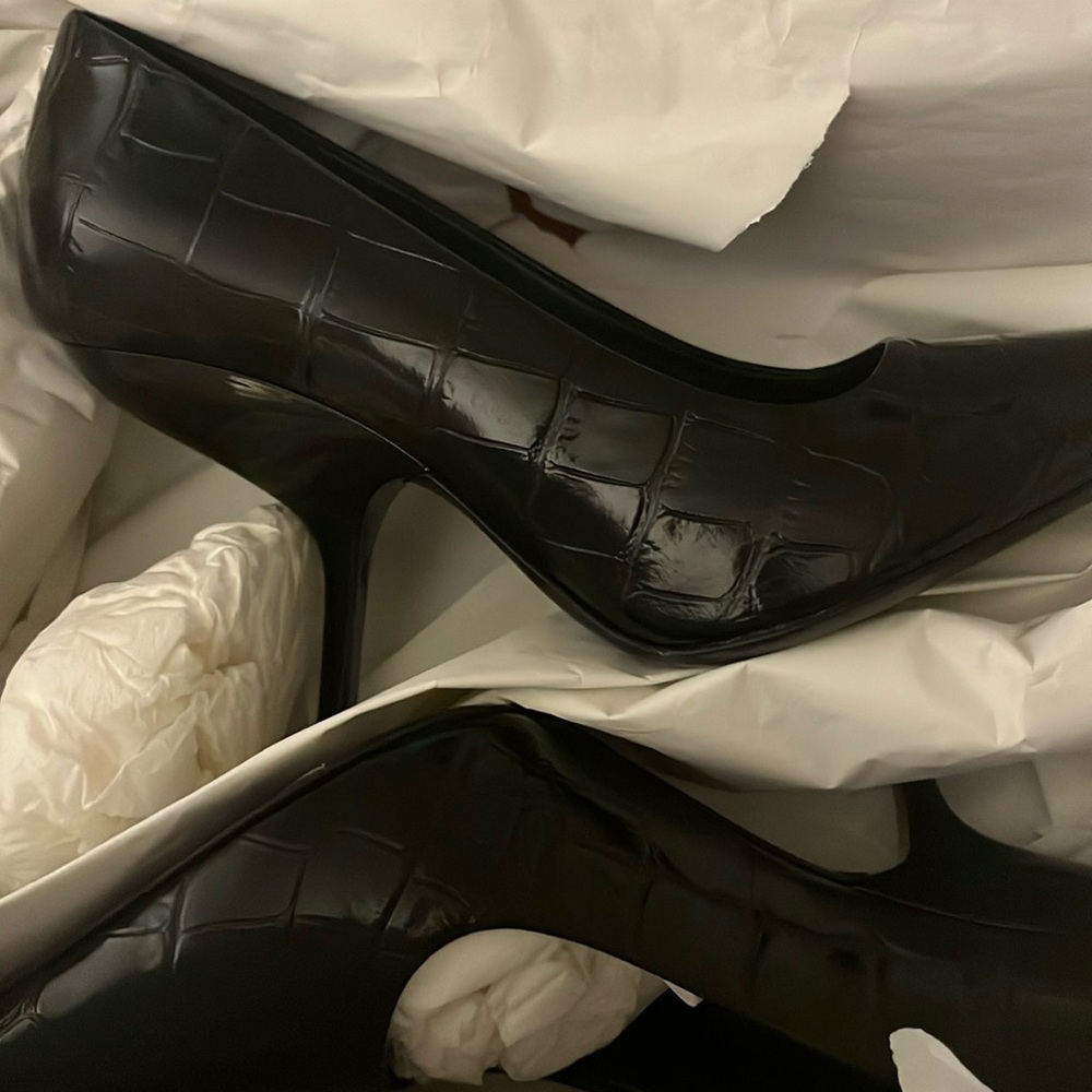 Black Ferragamo spike heels. Brand new